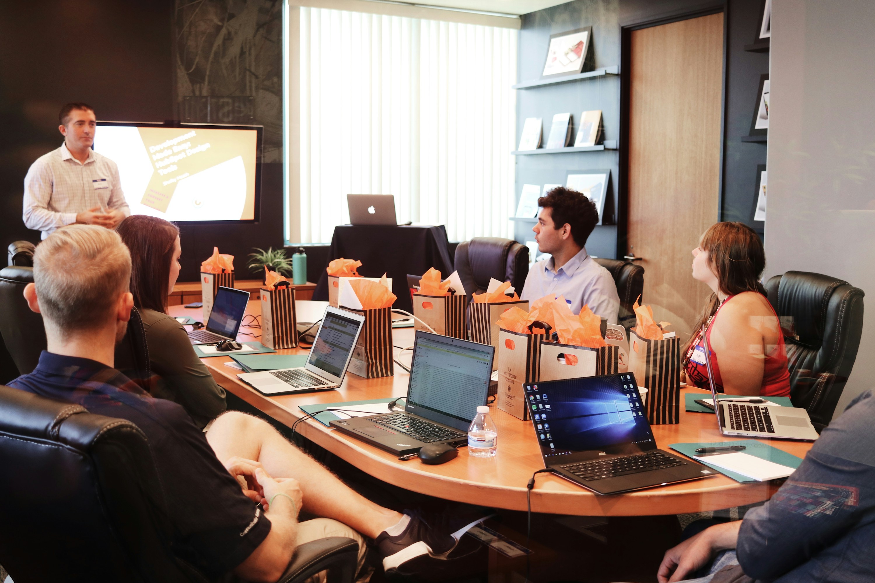 A group discussing work around a conference table
