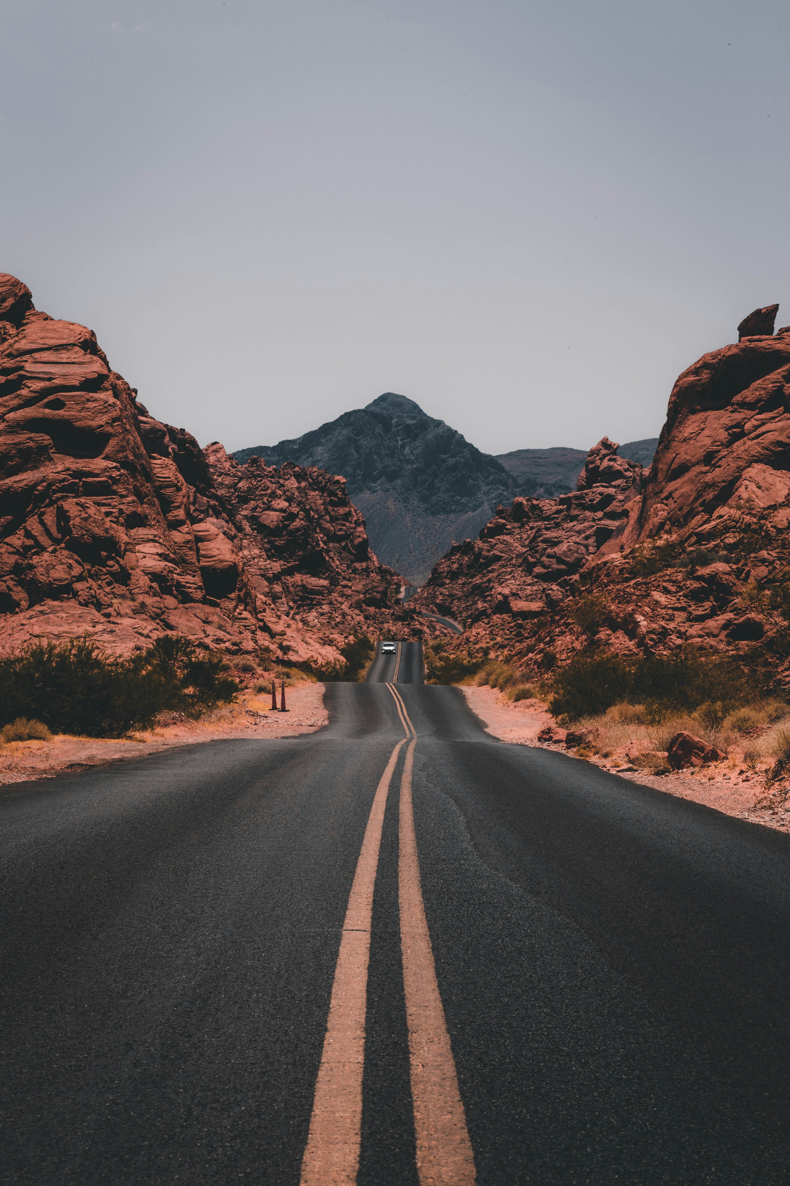 A road continuing through a complex rocky landscape